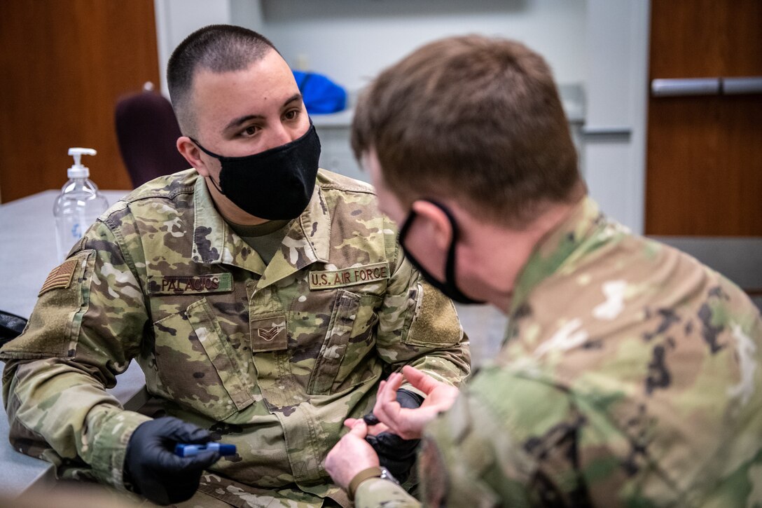 U.S. Air Force Reserve Senior Airman Hamid Palacios, 932nd Medical Group, medical technician, prepares to administer a glucose test during a medical skills rodeo, April 9, 2021, Scott Air Force Base, Illinois.  The training included giving a test, reading and discussing the signs and symptoms of high glucose.  (U.S. Air Force photo by Christopher Parr)