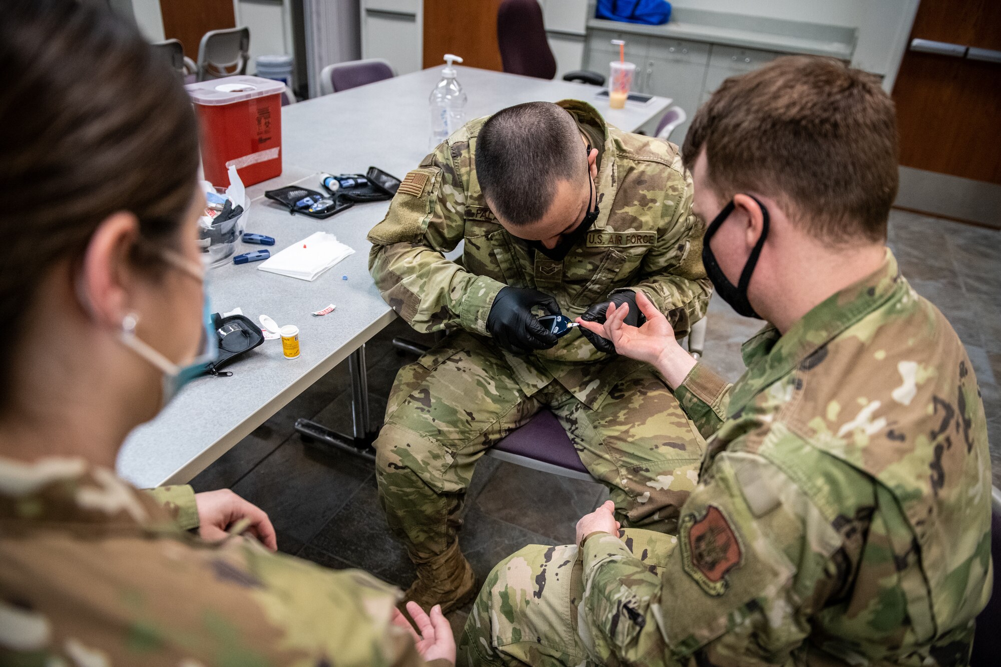 U.S. Air Force Reserve Senior Airman Hamid Palacios, 932nd Medical Group, medical technician, prepares to administer a glucose test during a medical skills rodeo, April 9, 2021, Scott Air Force Base, Illinois.  The training included giving a test, reading and discussing the signs and symptoms of high glucose.  (U.S. Air Force photo by Christopher Parr)