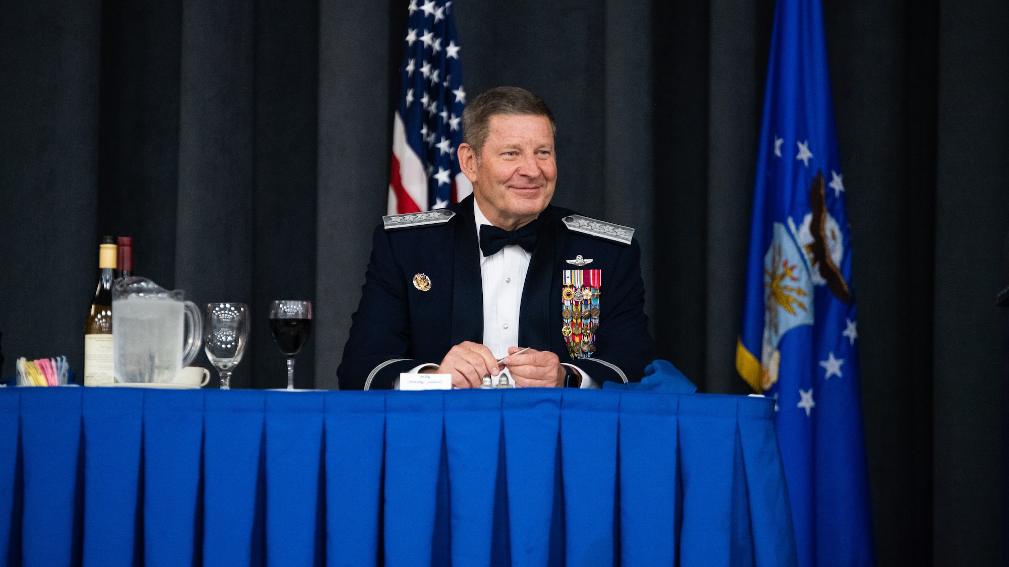 Retired Gen. Robin Rand, former Air Force Global Strike Command commander, sits at the head table during an Order of the Sword ceremony at Barksdale Air Force Base, Louisiana, April 23, 2021. The Order of the Sword is a rare honor bestowed on a senior officer or civilian by the enlisted corps of a command. (U.S. Air Force photo by Airman 1st Class Jacob B. Wrightsman)