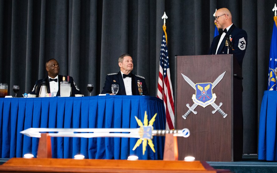 Retired Gen. Robin Rand, former Air Force Global Strike Command commander, is honored at an Order of the Sword ceremony at Barksdale Air Force Base, Louisiana, April 23, 2021. The Order of the Sword is a rare honor bestowed on a senior officer or civilian by the noncommissioned officers of a command to recognize individuals who have made significant contributions to the enlisted corps. (U.S. Air Force photo by Airman 1st Class Jacob B. Wrightsman)