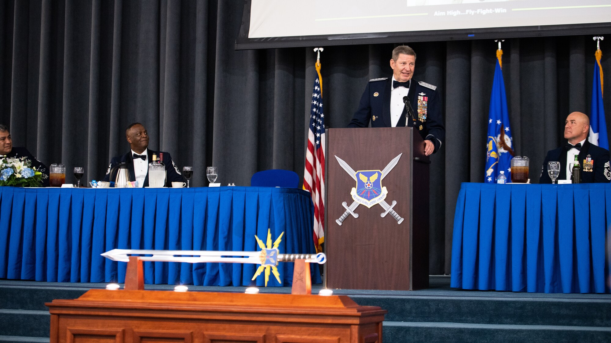 Retired Gen. Robin Rand, center, former Air Force Global Strike Command commander, makes remarks after being honored at an Order of the Sword ceremony at Barksdale Air Force Base, Louisiana, April 23, 2021. The Order of the Sword ceremony was patterned after two orders of chivalry founded during the Middle Ages in Europe: the (British) Royal Order of the Sword and the Swedish Military Order of the Sword, still in existence today. (U.S. Air Force photo by Airman 1st Class Jacob B. Wrightsman)