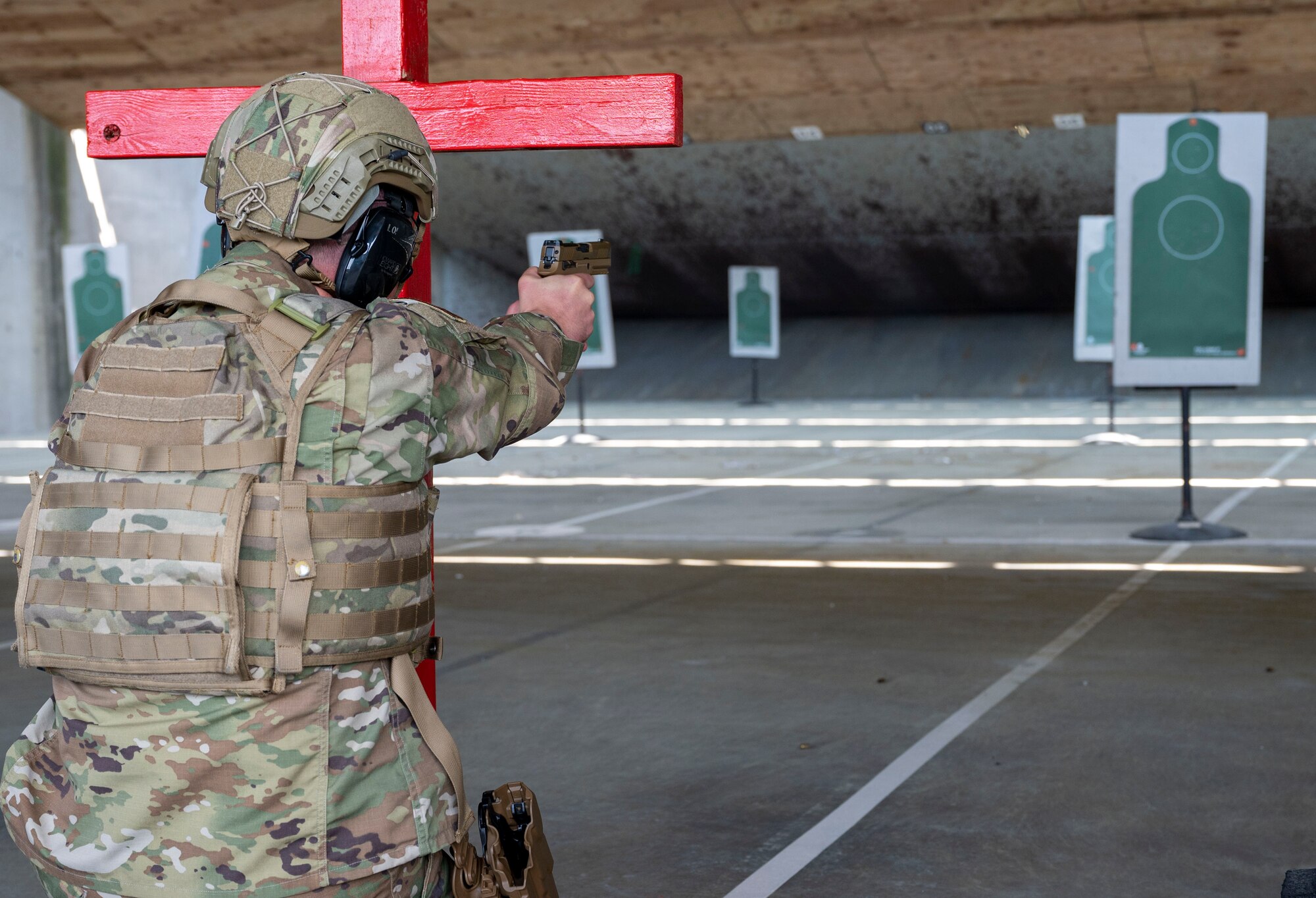 Col. Matthew Jones, 436th Airlift Wing commander, aims an M18 pistol at the Combat Arms Training and Maintenance facility on Dover Air Force Base, Delaware, April 27, 2021. The Air Force Life Cycle Management Center’s Small Arms Program Office acquired approximately 125,000 M18s which are now available to fulfill a variety of requirements throughout the Air Force.. (U.S. Air Force photo by Airman 1st Class Cydney Lee)