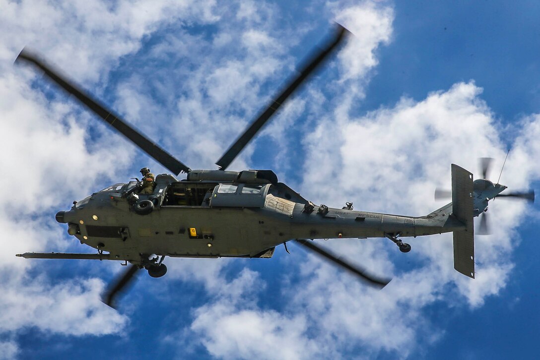 A look underneath an airborne helicopter.