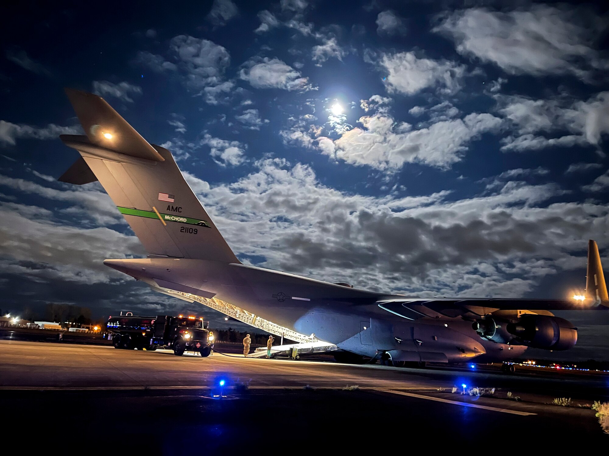 U.S. Air Force Airmen with the 62nd Airlift Wing and 627th Logistics Readiness Squadron perform a wet-wing defuel procedure on a C-17 Globemaster III as part of Exercise Rainier War at Joint Base Lewis-McChord, Washington, April 27, 2021. Rainier War tests the 62nd Airlift Wing's capability to plan, generate and execute a deployment tasking, sustain contingency operations, demonstrate full spectrum readiness while executing agile combat employment in a contested, degraded and operationally limited environment. (U.S. Air Force photo by Master Sgt. Julius Delos Reyes)