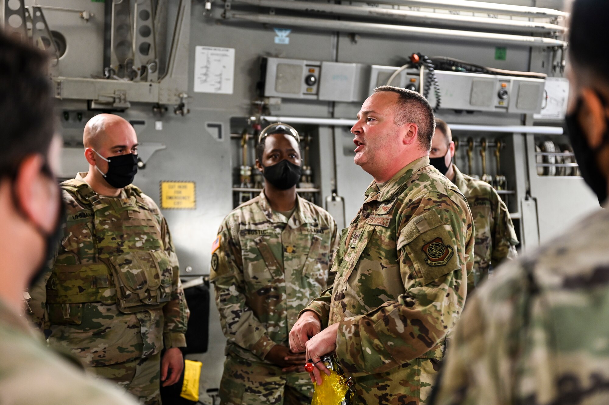 U.S. Air Force Master Sgt. Cole Rehse, 8th Airlift Squadron loadmaster, provides a flight safety briefing to U.S. Army Soldiers aboard a C-17 Globemaster III as part of Exercise Rainier War at Joint Base Lewis-McChord, Washington, April 28, 2021. Rainier War tests the 62nd Airlift Wing's capability to plan, generate and execute a deployment tasking, sustain contingency operations, demonstrate full spectrum readiness while executing agile combat employment in a contested, degraded and operationally limited environment. (U.S. Air Force photo by Master Sgt. Julius Delos Reyes)