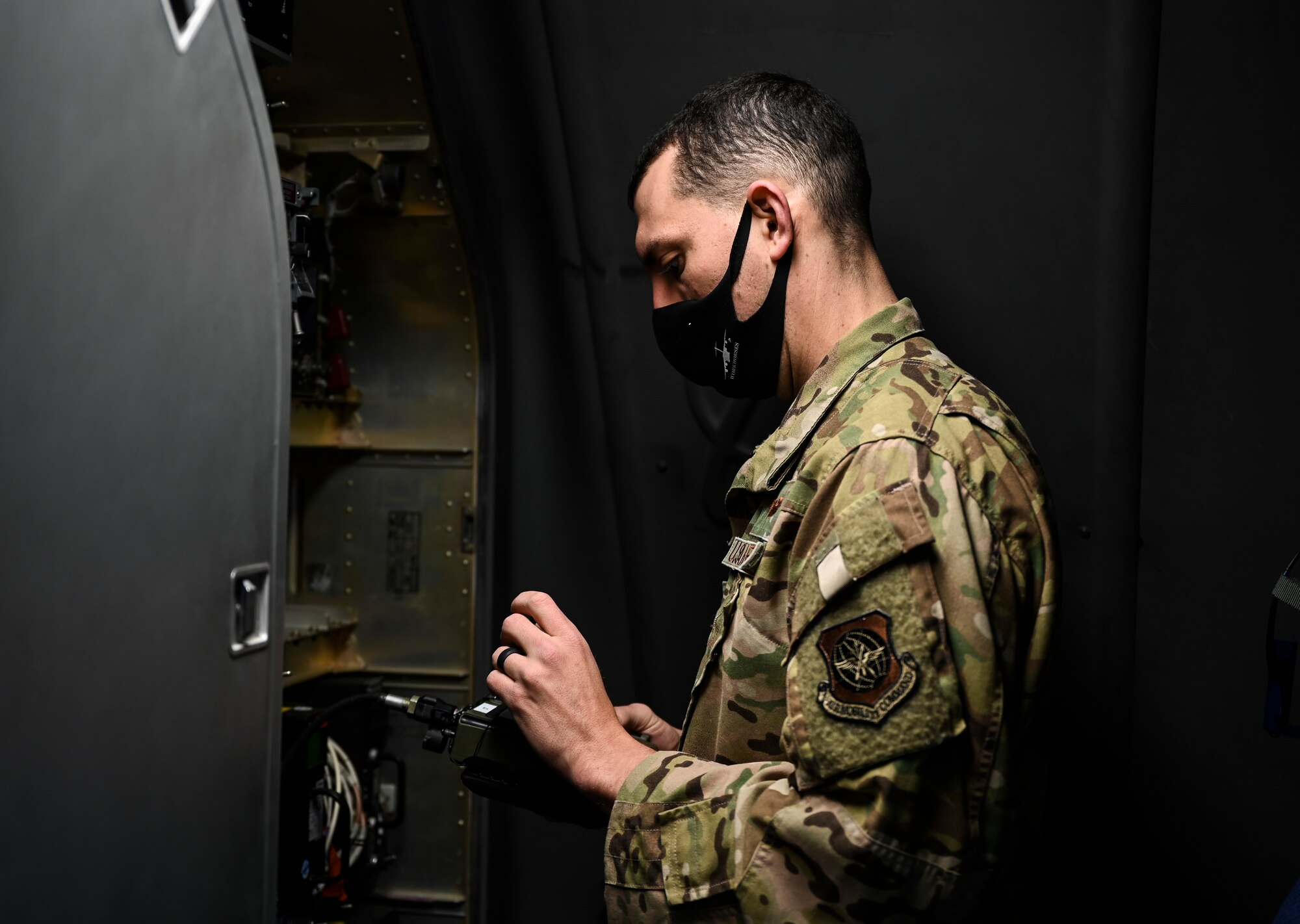 U.S. Air Force Capt. Chris Rolon, 62nd Operations Support Squadron aircraft commander, checks communication equipment prior to an airlift mission as part of Exercise Rainier War at Joint Base Lewis-McChord, Washington, April 28, 2021. Rainier War tests the 62nd Airlift Wing's capability to plan, generate and execute a deployment tasking, sustain contingency operations, demonstrate full spectrum readiness while executing agile combat employment in a contested, degraded and operationally limited environment. (U.S. Air Force photo by Master Sgt. Julius Delos Reyes)