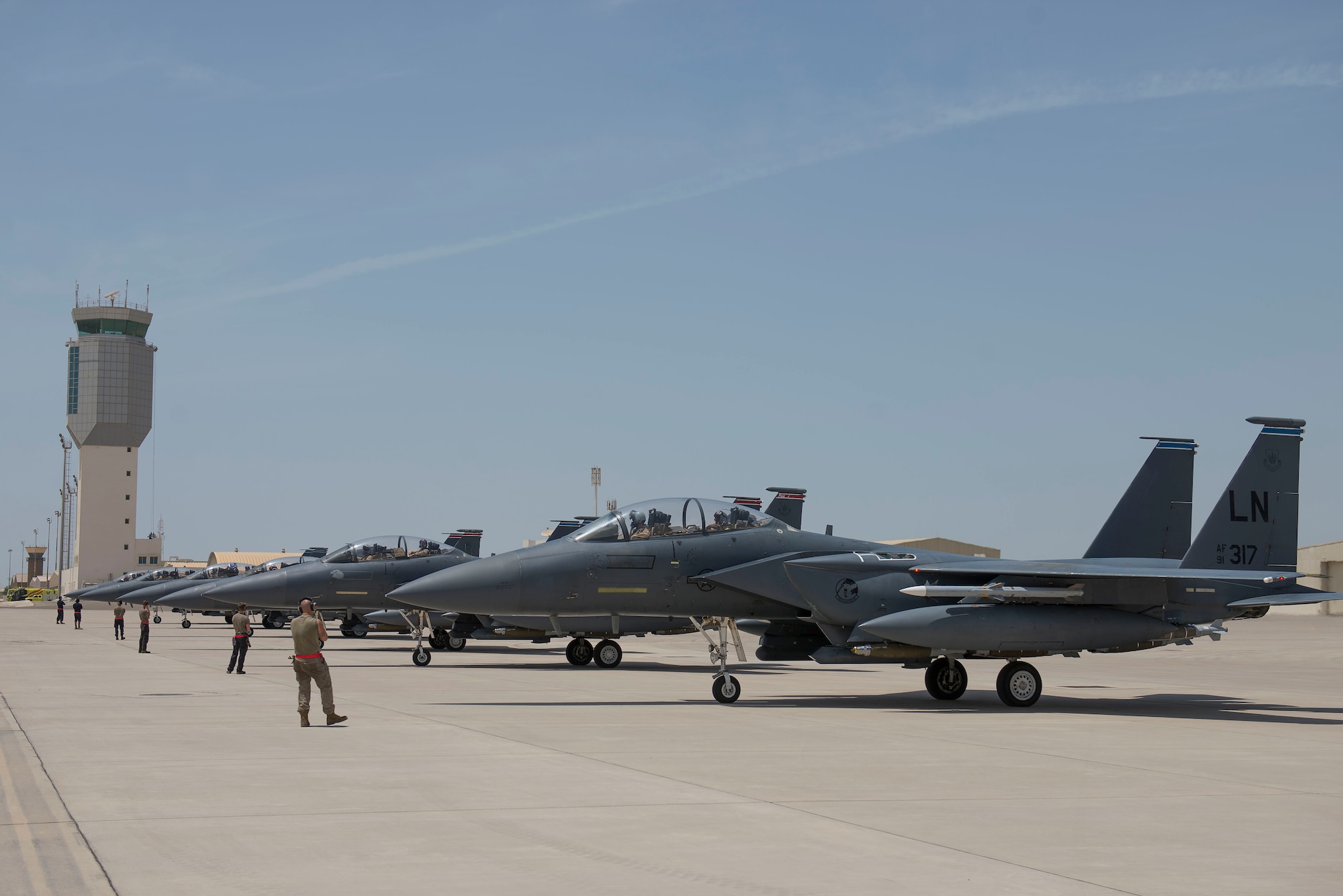 Six F-15E Strike Eagles assigned to the 494th Expeditionary Fighter Squadron (EFS) line up on the flightline at Al Dhafra Air Base, United Arab Emirates, April 25, 2021.