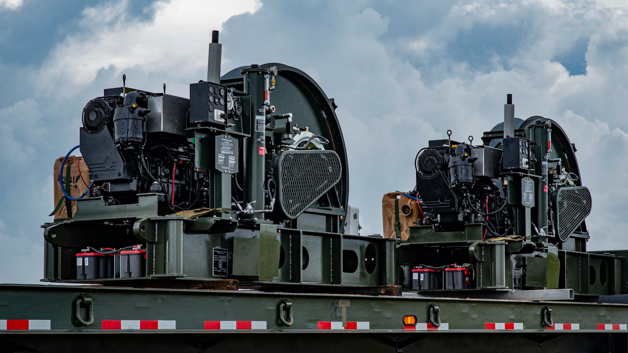 Two Barrier Arresting Kits sit on a trailer on the flight line at Andersen Air Force Base, Guam, April 26, 2021.