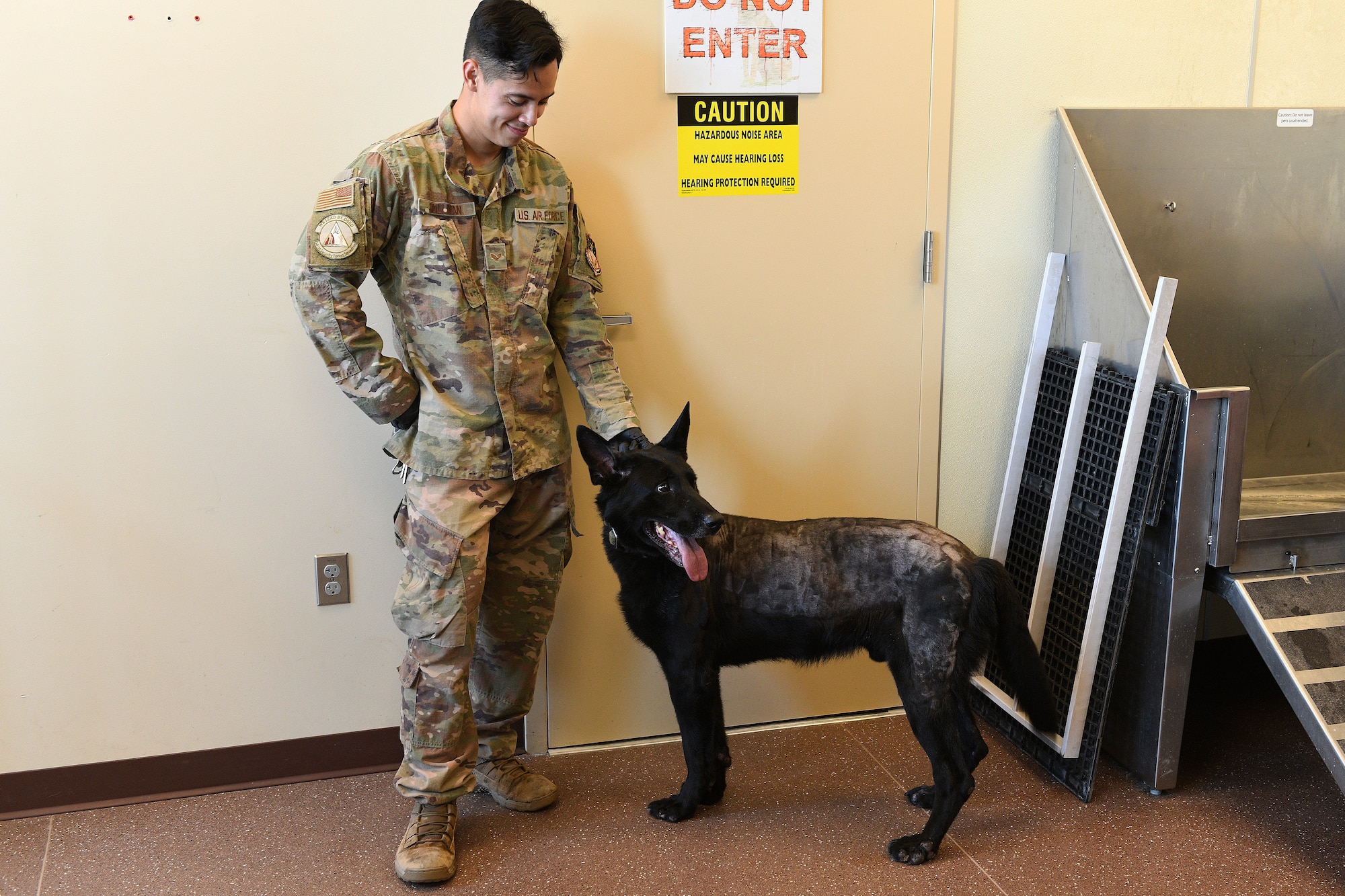 Senior Airman Dustin Sullivan, left, 341st Security Forces Squadron MWD handler, and MWD Erik, prepare for a medical evaluation Aug. 26, 2020, at Malmstrom Air Force Base, Mont.