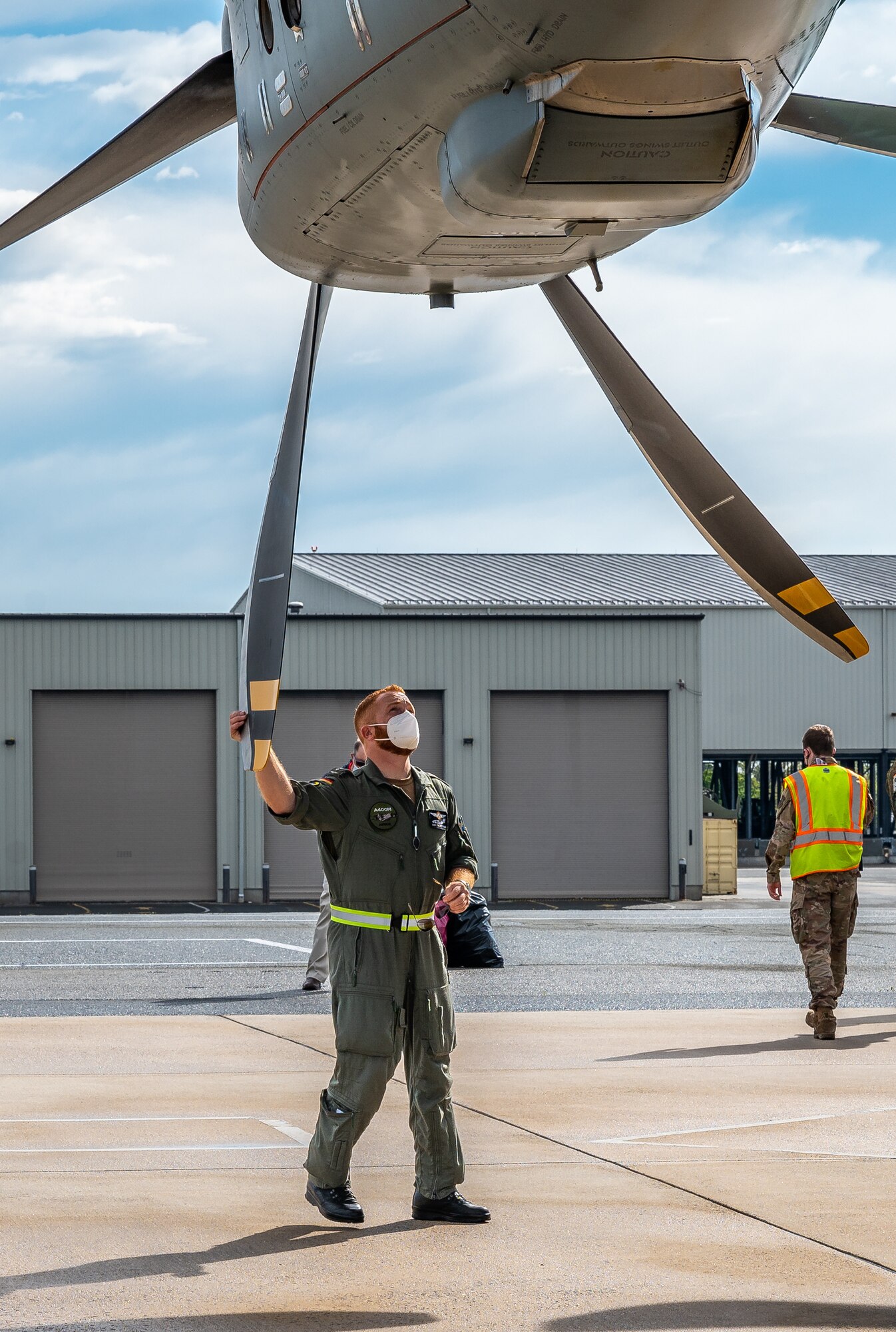 A German air force airman checks the propeller of an A-400M Atlas as they prepare for takeoff after completing a foreign military sales mission at Dover Air Force Base, Delaware, April 19, 2021. Germany is a key NATO ally, helping to strengthen regional security and encourage peace and unity in Europe. Dover AFB’s FMS mission supports approximately $3.5 billion worth of equipment annually. (U.S. Air Force photo by Senior Airman Christopher Quail)