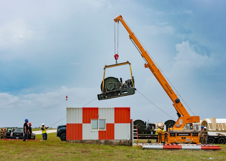 The 36th Civil Engineer Squadron removes an old Barrier Arresting Kit from the flight line at Andersen Air Force Base, Guam, April 26, 2021. According to the technical order, BAK-12s are overhauled and replaced every ten years. The BAK-12 feeds a cable across the flight line and, in the case of an in-flight emergency, acts as a mechanical barrier that rapidly decelerates a landing aircraft.