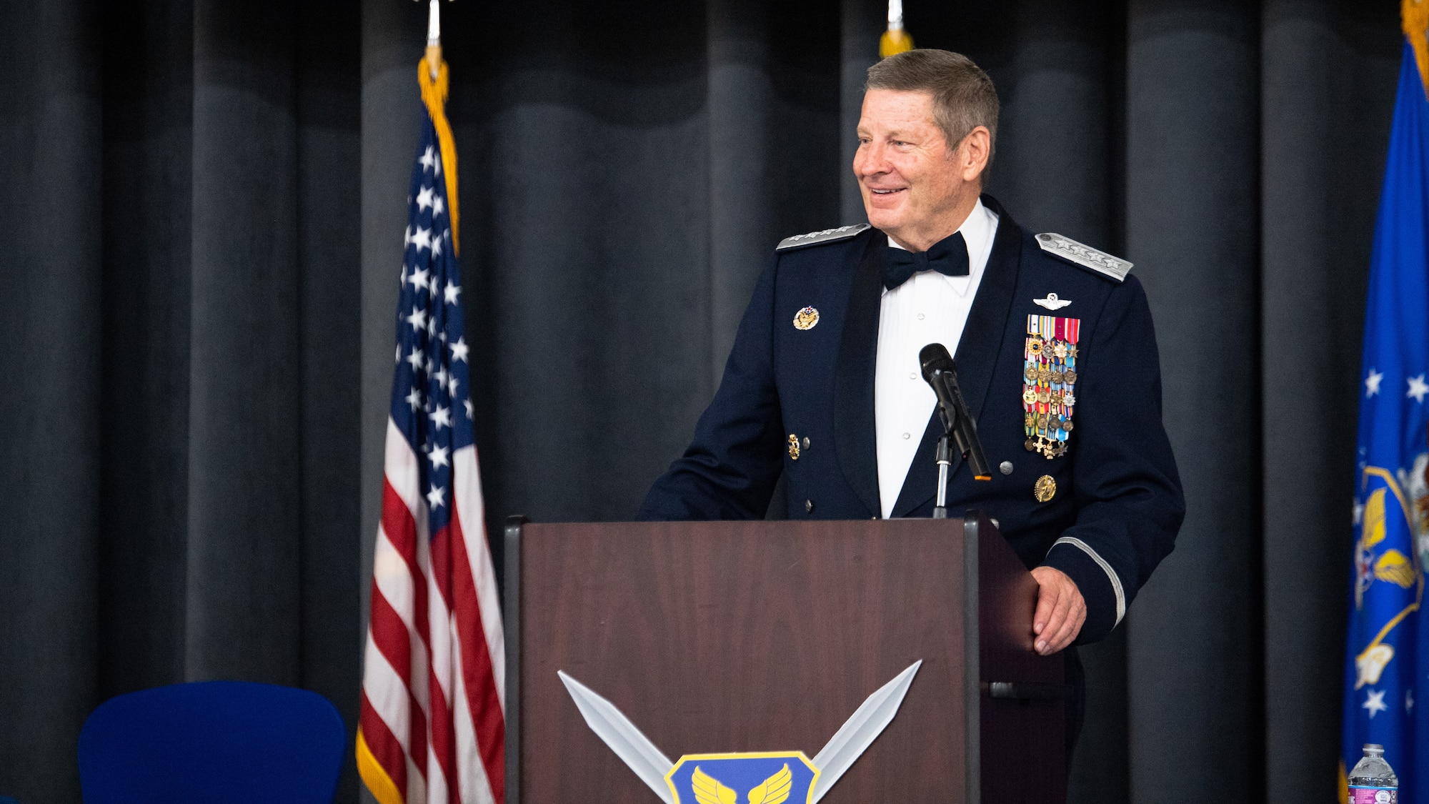 Retired Gen. Robin Rand, former Air Force Global Strike Command commander, makes remarks after being honored at an Order of the Sword ceremony at Barksdale Air Force Base, Louisiana, April 23, 2021. The Order of the Sword is a rare honor bestowed on a senior officer or civilian by the enlisted corps of a command. (U.S. Air Force photo by Airman 1st Class Jacob B. Wrightsman)