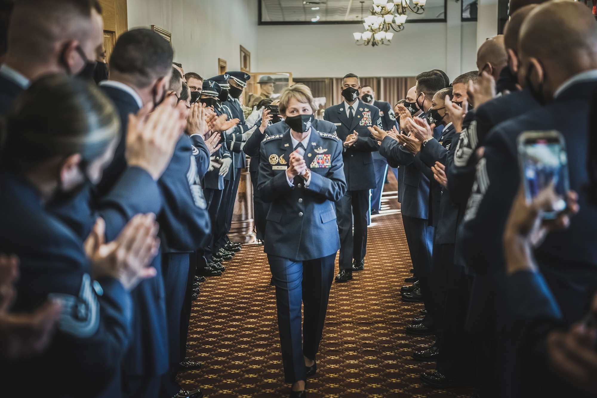 U.S. Air Force Gen., retired, Maryanne Miller, is welcomed by a room of applause as she arrives at the Air Mobility Command’s Order of the Sword ceremony in her honor at Joint Base McGuire-Dix-Lakehurst, N.J, April 23, 2021.