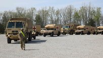 Medical vehicles attached to the 546th Area Support Medical Company depart a staging area during exercise Guardian Response 21 (GR 21) on Camp Atterbury, Indiana, April 27, 2021.