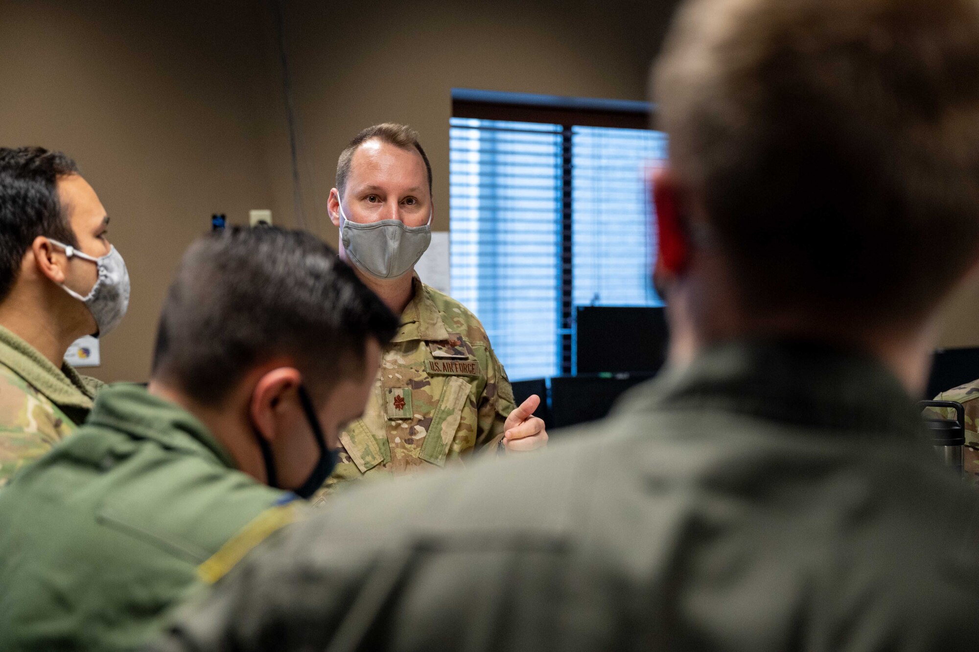 Maj. James Johnson, 3rd Airlift Squadron pilot, briefs 3rd AS aircrew members before a local training flight at Dover Air Force Base, Delaware, April 22, 2021. The 3rd AS trains to support global engagement through direct delivery of critical theater assets and to ensure combat readiness of Air Mobility Command C-17 aircrews. (U.S. Air Force photo by Airman 1st Class Faith Schaefer)
