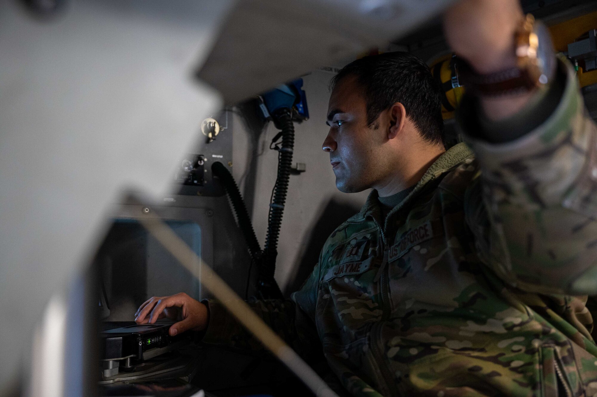 Capt. Steven Jayme, 3rd Airlift Squadron pilot, completes a preflight check on a C-17 Globemaster III at Dover Air Force Base, Delaware, April 22, 2021. The 3rd AS trains to support global engagement through direct delivery of critical theater assets and to ensure combat readiness of Air Mobility Command C-17 aircrews. (U.S. Air Force photo by Airman 1st Class Faith Schaefer)