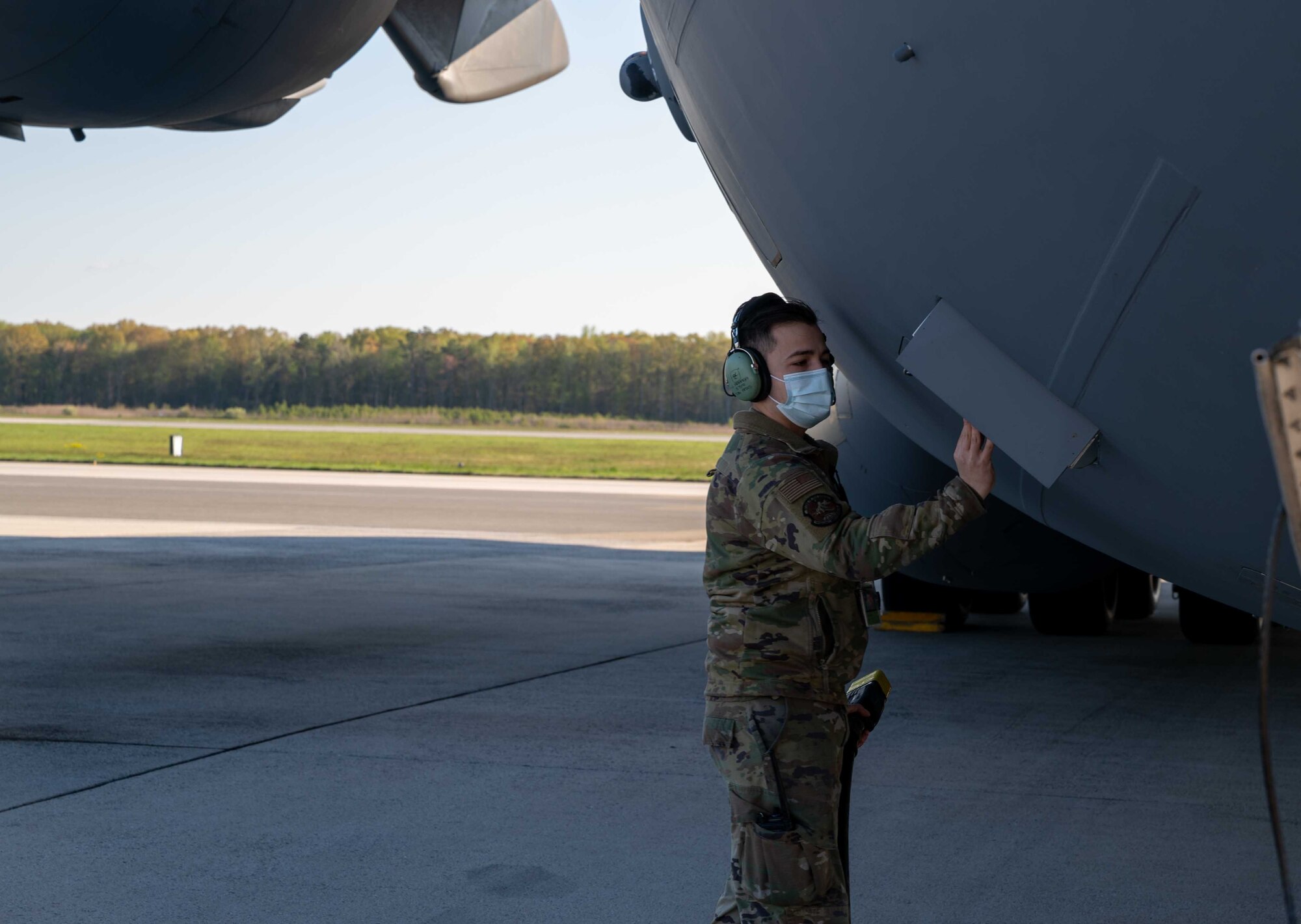 Staff Sgt. Jorge Arriaga, 736th Aircraft Maintenance Squadron crew chief, unplugs a power cart from a C-17 Globemaster III at Dover Air Force Base, Delaware, April 22, 2021. The 736th AMXS maintains the C-17 fleet at Dover AFB to provide global reach with unique, outsized and oversized airlift capability. (U.S. Air Force photo by Airman 1st Class Faith Schaefer)