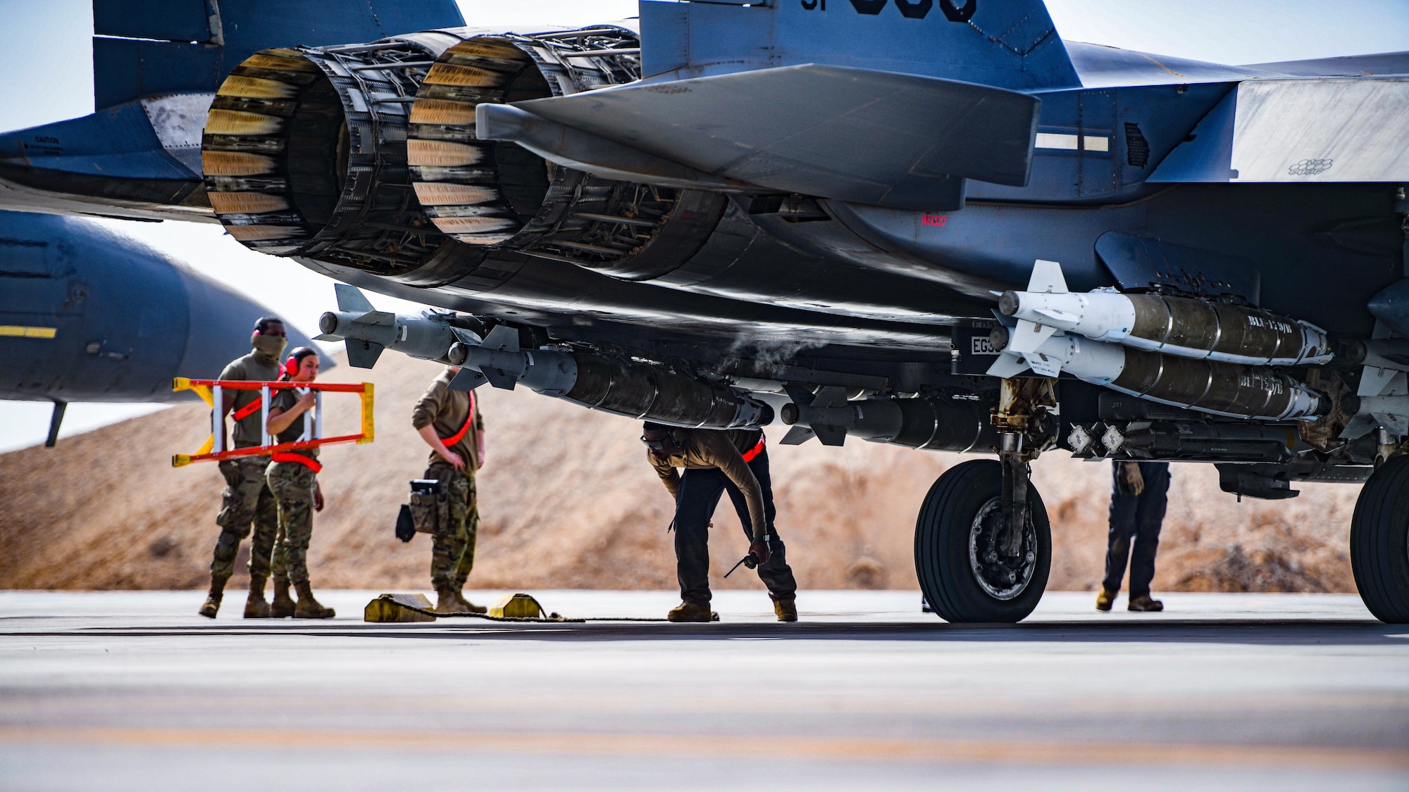 The 332 Air Expeditionary Wing blazed new trails when they configured six F-15E Strike Eagles to carry extra bombs to bare base locations, taking off from an undisclosed location 25 April 2021. This new configuration is allowing the Air Force to increase combat capabilities, by carrying more munitions than the Strike Eagle can use on one mission, to a forward operating base.