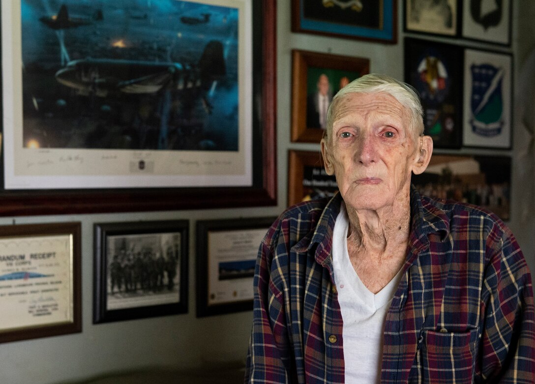 WWII veteran Jim “Pee Wee” Martin, poses for a photo inside his Xenia, Ohio home, April 15, 2021. Martin served as a paratrooper assigned to 101st Airborne Division, 506th Infantry Regiment, G Company, out of Fort Campbell, Kentucky. (U.S. Air Force photo by Wesley Farnsworth)