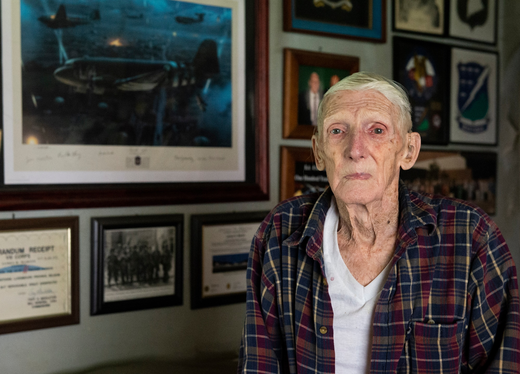 WWII veteran Jim “Pee Wee” Martin, poses for a photo inside his Xenia, Ohio home, April 15, 2021. Martin served as a paratrooper assigned to 101st Airborne Division, 506th Infantry Regiment, G Company, out of Fort Campbell, Kentucky. (U.S. Air Force photo by Wesley Farnsworth)
