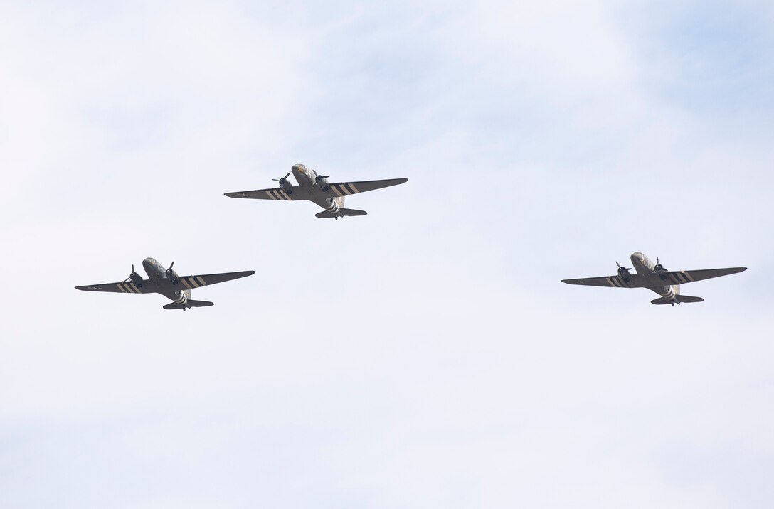 Three C-47 Dakotas, including the famous “That’s All, Brother”, perform a flyover during a 100th birthday celebration for WWII veteran Jim “Pee Wee” Martin, April 23, 2021, in Xenia, Ohio. “That’s All, Brother,” led the main airborne invasion of Normandy. Martin served as a paratrooper assigned to 101st Airborne Division, 506th Infantry Regiment, G Company, out of Fort Campbell, Kentucky. (U.S. Air Force photo by Wesley Farnsworth)