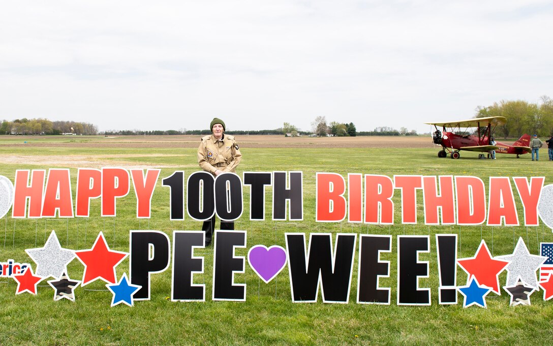 WWII veteran Jim “Pee Wee” Martin, poses for a photo during a 100th birthday celebration held in his honor April 23, 2021, in Xenia, Ohio. Martin served as a paratrooper assigned to 101st Airborne Division, 506th Infantry Regiment, G Company, out of Fort Campbell, Kentucky. (U.S. Air Force photo by Wesley Farnsworth)