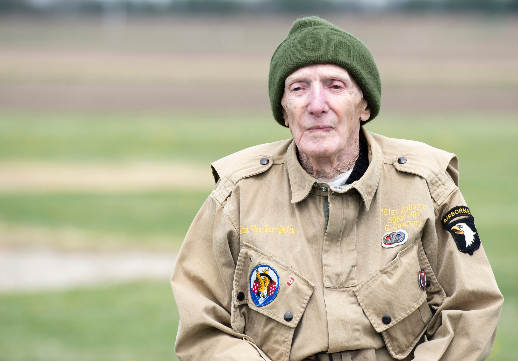 WWII veteran Jim “Pee Wee” Martin, poses for a photo during a 100th birthday celebration held in his honor April 23, 2021, in Xenia, Ohio. Martin served as a paratrooper assigned to 101st Airborne Division, 506th Infantry Regiment, G Company, out of Fort Campbell, Kentucky. (U.S. Air Force photo by Wesley Farnsworth)