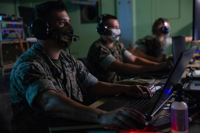 U.S. Marines with Marine Air Control Squadron 2 monitor simulated aircraft communications during exercise MISTEX-20 at Marine Corps Air Station Cherry Point, N.C., July 28, 2020. During the exercise, Marines practiced setting up communication between squadrons in Marine Air Control Group 28 while also exercising aircraft control skills necessary for successful combat flights in an expeditionary setting.