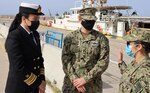 Lt. j.g. Alicia Evans, executive officer of USCGC Robert Goldman (WPC 1142) and Lt. j.g. Jacklyn Kokomoor, executive officer of USCGC Charles Moulthrope (WPC 1141), talks with their colleague of the Hellenic coast guard while in Greece on April 28, 2021.