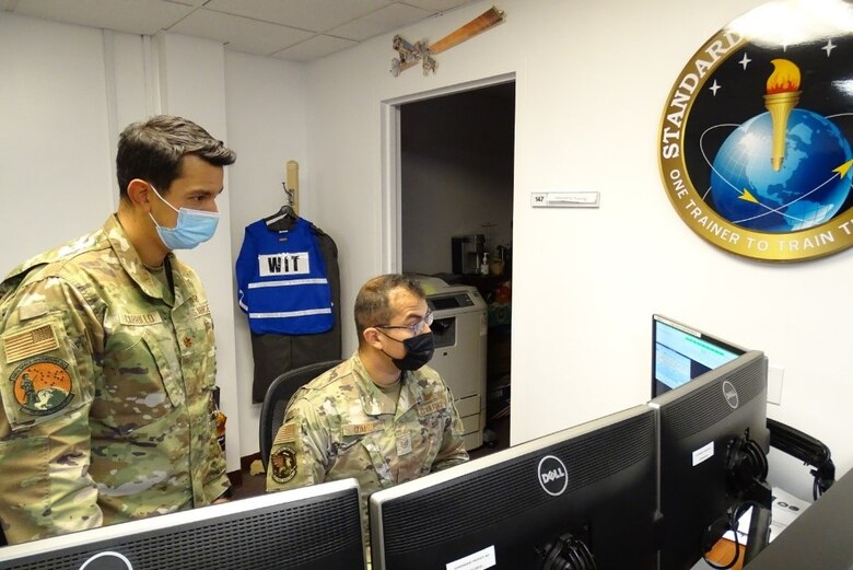Photo of airmen training at a computer station