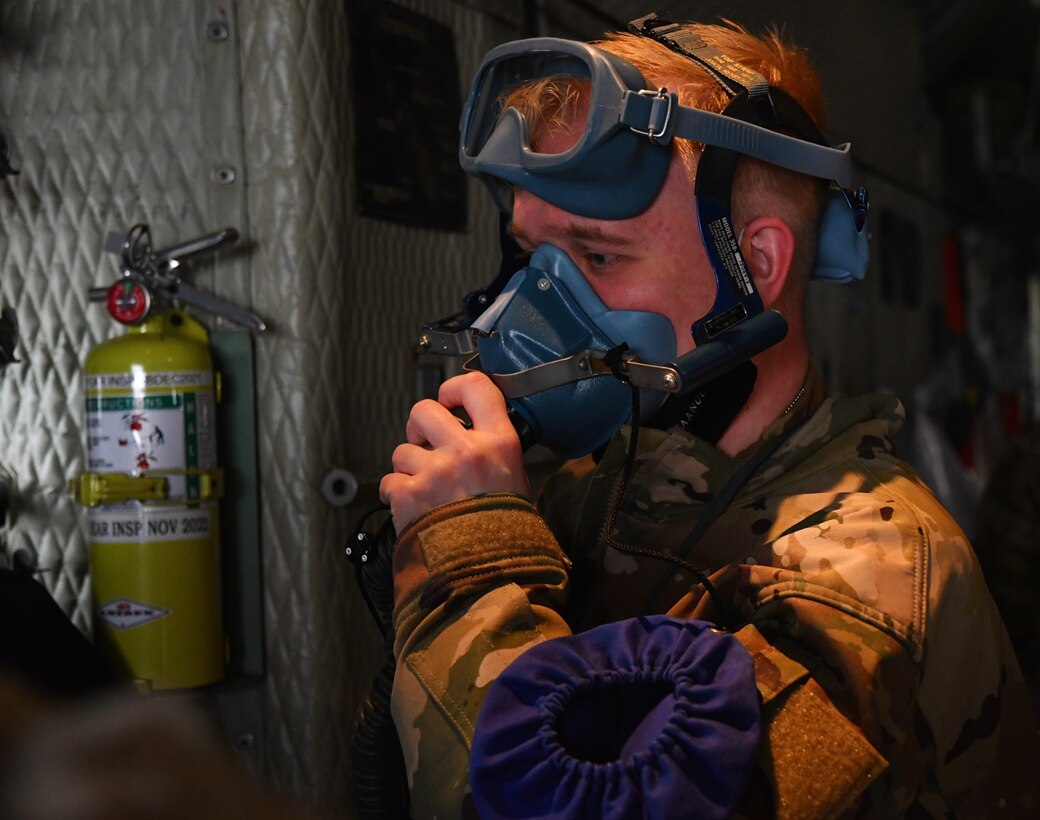 932nd Airlift Wing Aeromedical Evacuation Squadron (AES) personnel prepare equipment as they train with a visiting C-130 aircraft on April 24, 2021, Scott Air Force Base, Ill. The 932nd Airlift Wing's AES worked improving and refining medical skills at the reserve unit, which included visiting members of the 910th Airlift Wing from Youngstown, Ohio. Airmen worked together on first aid skills, responding to emergencies, and taking care of patients in the air. Simulated patients were moved safely on to the waiting plane. The compact, highly-packed training was designed to improve readiness and be ready for any future medical missions. (U.S. Air Force photo by Lt. Col. Stan Paregien)