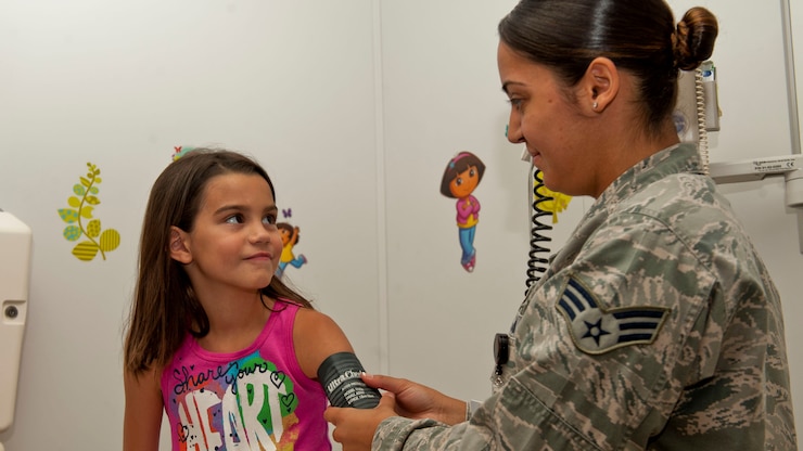 child receives sports physical