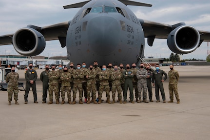Airmen from the 437th Airlift Wing and Cadets from detachment 290 pose for a group photo, at Lexington, Kentucky, April 23, 2021.