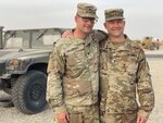 Spc. Tyler Goldsberry, left, 2nd General Support Battalion, 104th Aviation Regiment, and chief warrant officer Craig Goldsberry, right, 111th Engineer Brigade, son and father respectively, in Kuwait in April 2021. The two West Virginia Army National Guard members are deployed in support of Operation Spartan Shield and, although assigned to different units, their deployment timelines overlap by nearly two months, allowing for a long-awaited reunion.