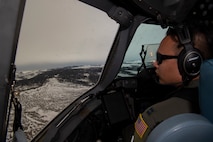 U.S. Air Force Capt. Tony Urbino, an aircraft commander from the 15th Airlift Squadron, and Capt. Ryan Sunderland, a co-pilot from the 16th Airlift Squadron, conduct a low level training flight over Montana, April 25, 2021.
