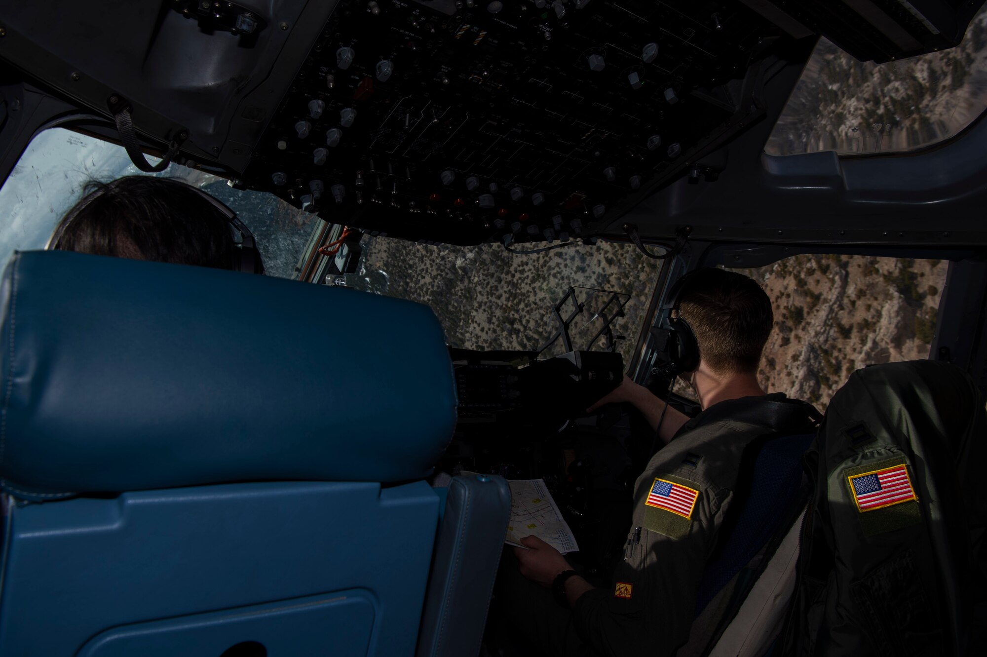 U.S. Air Force Capt. Tony Urbino, an aircraft commander from the 15th Airlift Squadron, and Capt. Ryan Sunderland, a co-pilot from the 16th Airlift Squadron, conduct a low level training flight over Montana, April 25, 2021