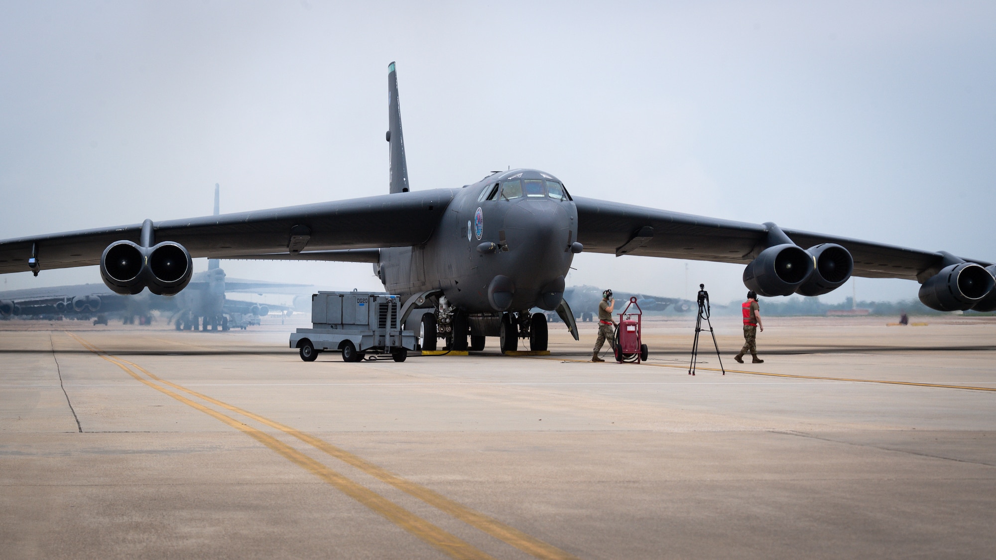 Senior Airman Ryan Braun and Airman 1st Class Eric Dearment, 96th Aircraft Maintenance Unit crew chiefs, lead a B-52H Stratofortress as it is “cart started” at Barksdale Air Force Base, Louisiana, April 28, 2021.