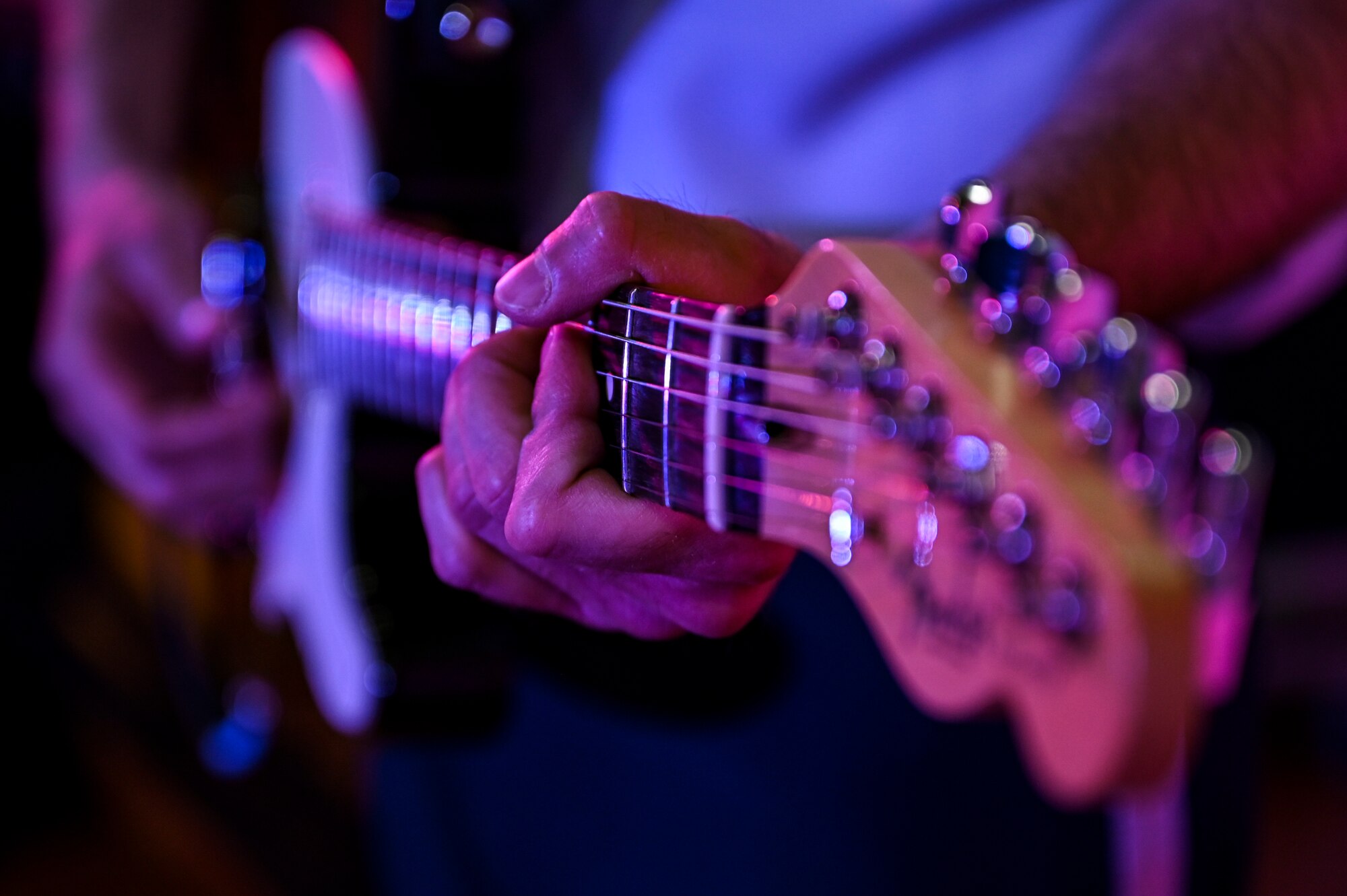 Airman 1st Class Brian Galaviz, a guitarist assigned to the AFCENT Band, plays guitar during an online concert for more than 50 students from the American International School located in Kuwait, April 25, 2021. The purpose of the concert was to introduce the students to American music, culture, and the AFCENT Band. (U.S. Air Force photo by Senior Airman Taylor Crul)
