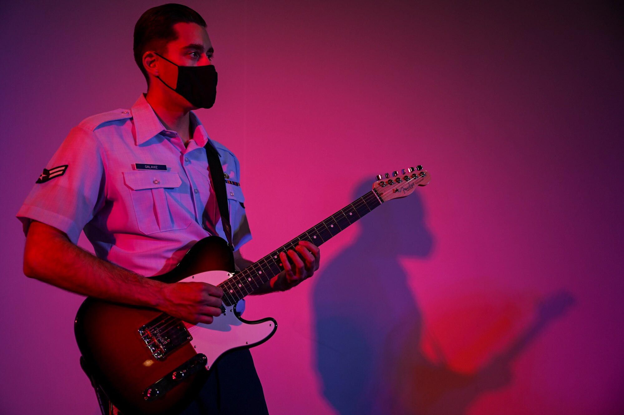Airman 1st Class Brian Galaviz, a guitarist assigned to the AFCENT Band, plays guitar during an online concert for more than 50 students from the American International School located in Kuwait, April 25, 2021. The purpose of the concert was to introduce the students to American music, culture, and the AFCENT Band. (U.S. Air Force photo by Senior Airman Taylor Crul)