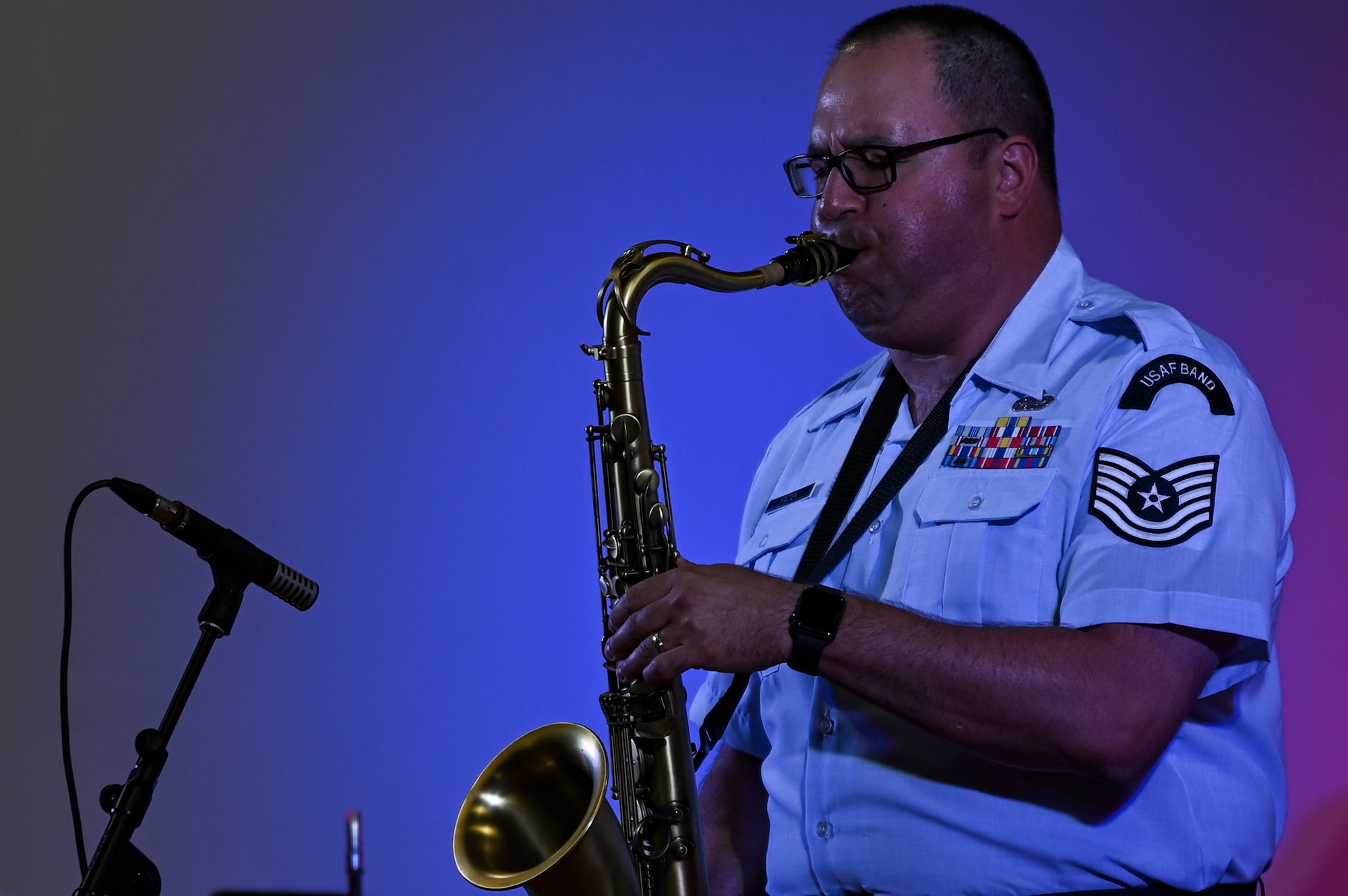 Tech. Sgt. David Fatek, a saxophonist assigned to the AFCENT Band, plays a saxophone during an online concert for more than 50 students from the American International School located in Kuwait, April 25, 2021. The purpose of the concert was to introduce the students to American music, culture, and the AFCENT Band. (U.S. Air Force photo by Senior Airman Taylor Crul)