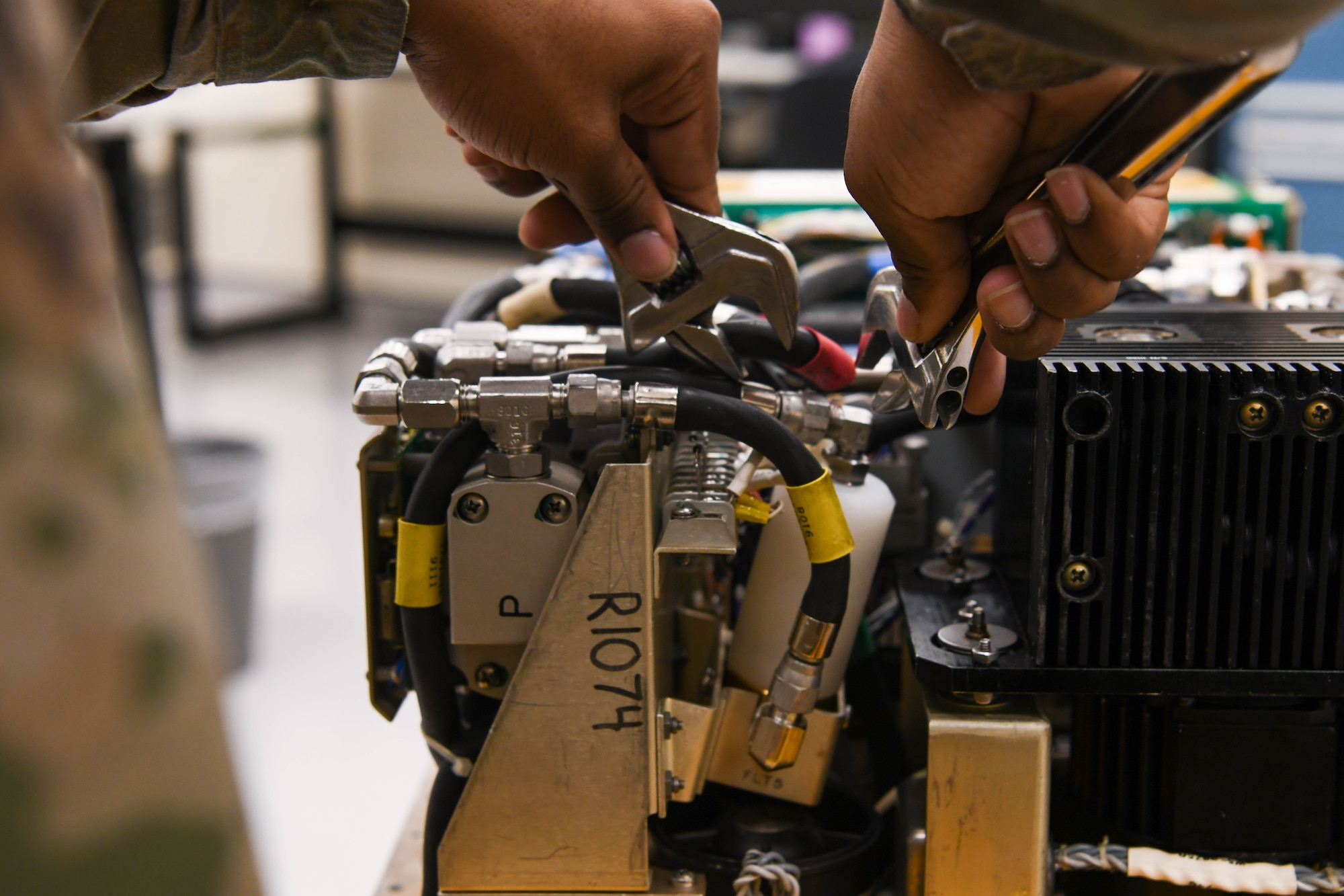 A precision measurement equipment laboratory technician from the 18th Component Maintenance Squadron calibrates a piece of equipment