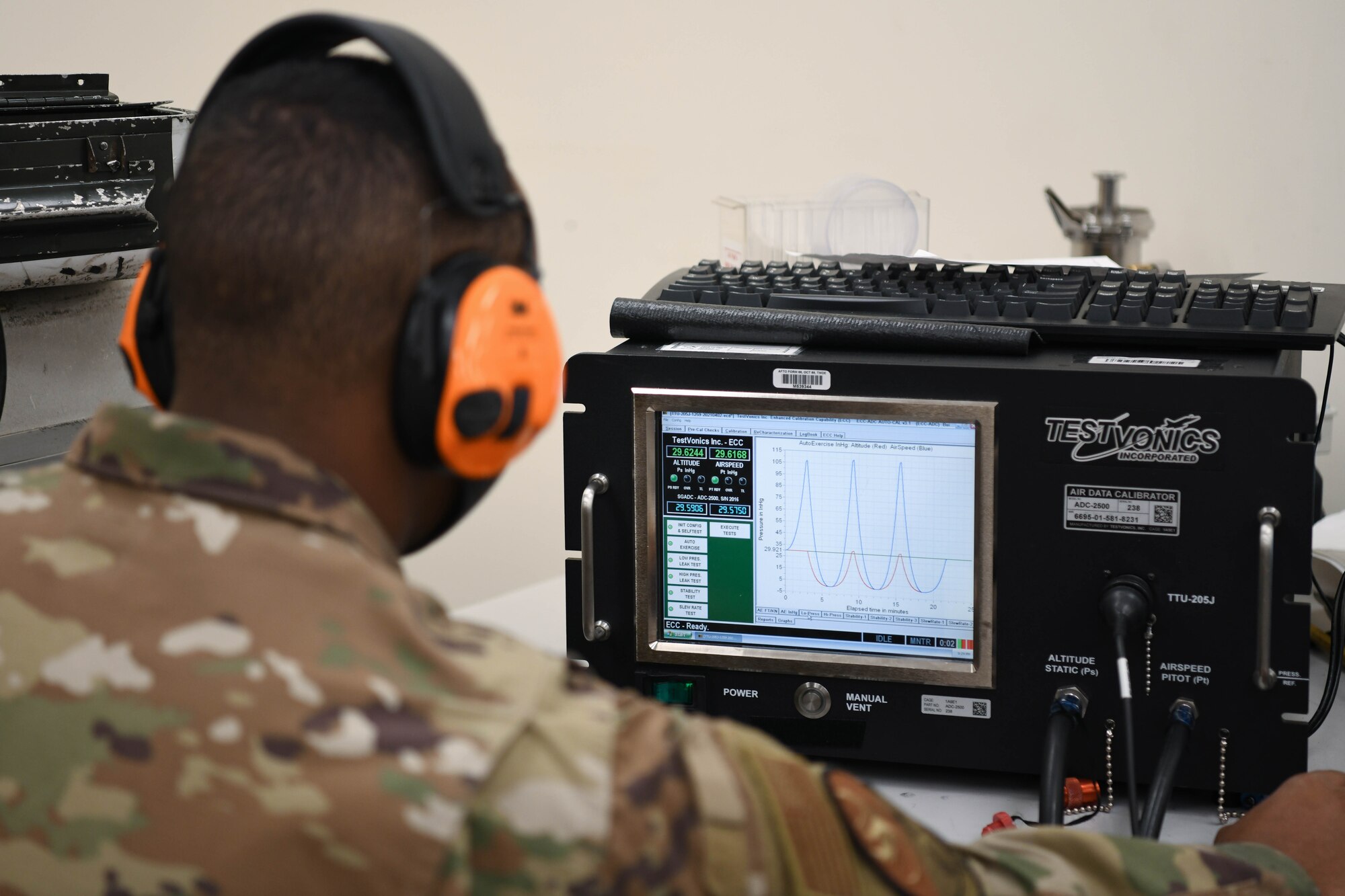 A precision measurement equipment laboratory technician from the 18th Component Maintenance Squadron calibrates a piece of equipment.