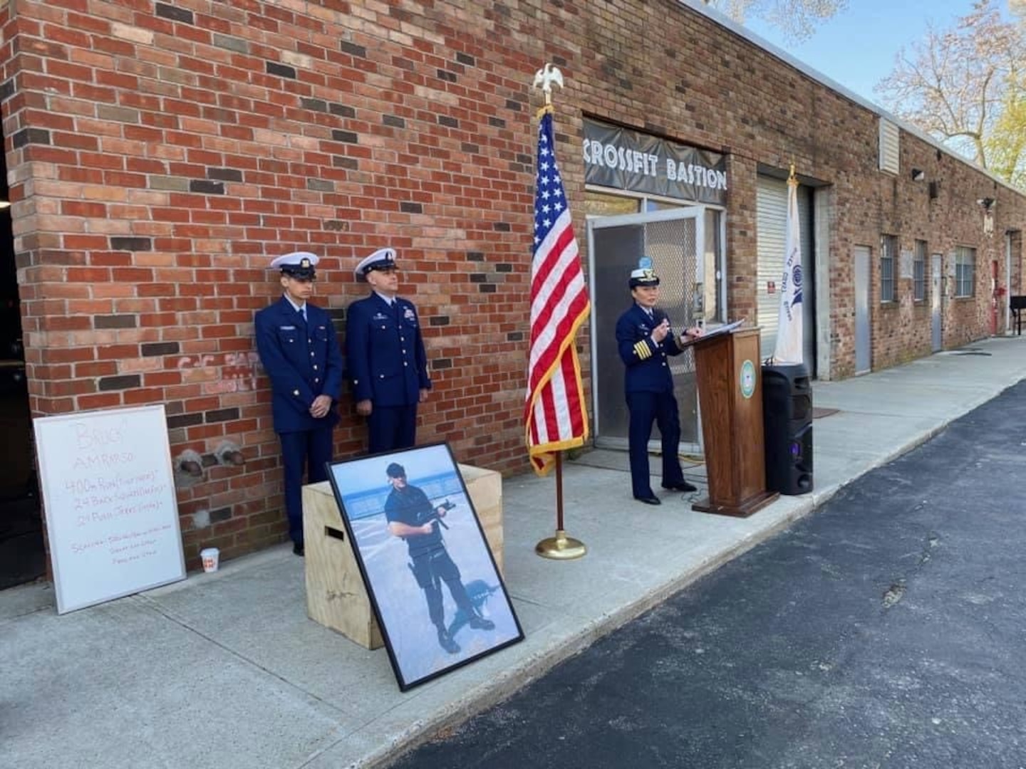 Capt. Eva VanCamp speaks at the Memorial Service with Fireman Apprentice Christopher Garcia-Rivera and Senior Chief Petty Officer Erich White from Station Eaton’s Neck, Huntingtion Station, New York, in  April 24, 2021. Photo by Lt. Tony Emanuele.