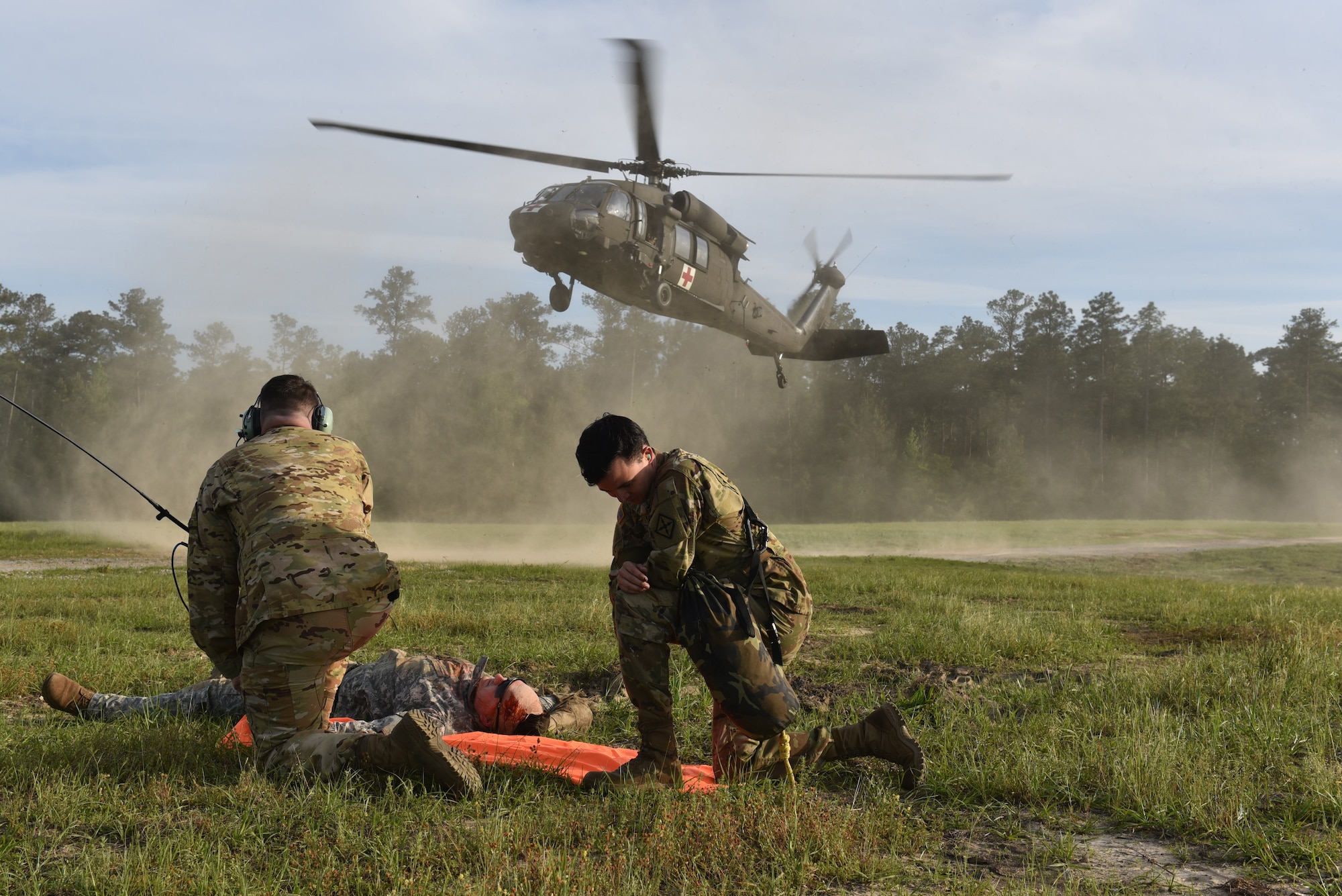 Soldiers with Company G, 3d Battalion, 238th Aviation Regiment, Mississippi Army National Guard, conduct MEDEVAC operations training as part of Southern Strike 2021 at Camp Shelby Joint Forces Training Center, April 22, 2021. Southern Strike is a large-scale, conventional and special operations exercise designed to maintain combat readiness, build relationships, strengthen interoperability and prepare for possible future contingency missions  (Temporary unmasking for members is due to conflicts with mission requirements) 
(U.S. Army National Guard photo by Sgt. Victoria Smith)