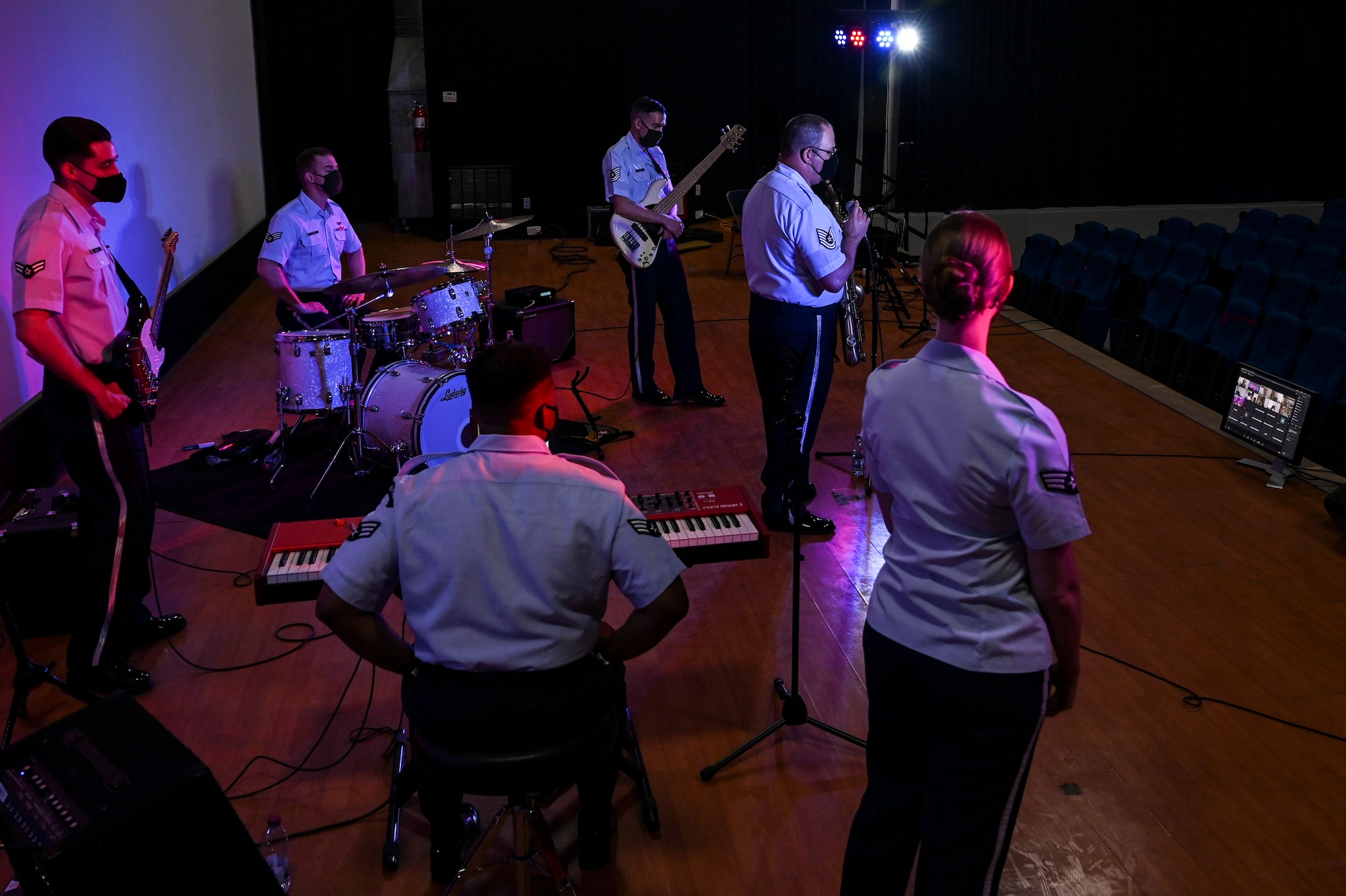 Members of the AFCENT Band answer questions from students during an online concert for over 50 students from the American International School located in Kuwait, April 25, 2021. The purpose of the concert was to introduce the students to American music, culture, and the AFCENT Band. (U.S. Air Force photo by Senior Airman Taylor Crul)