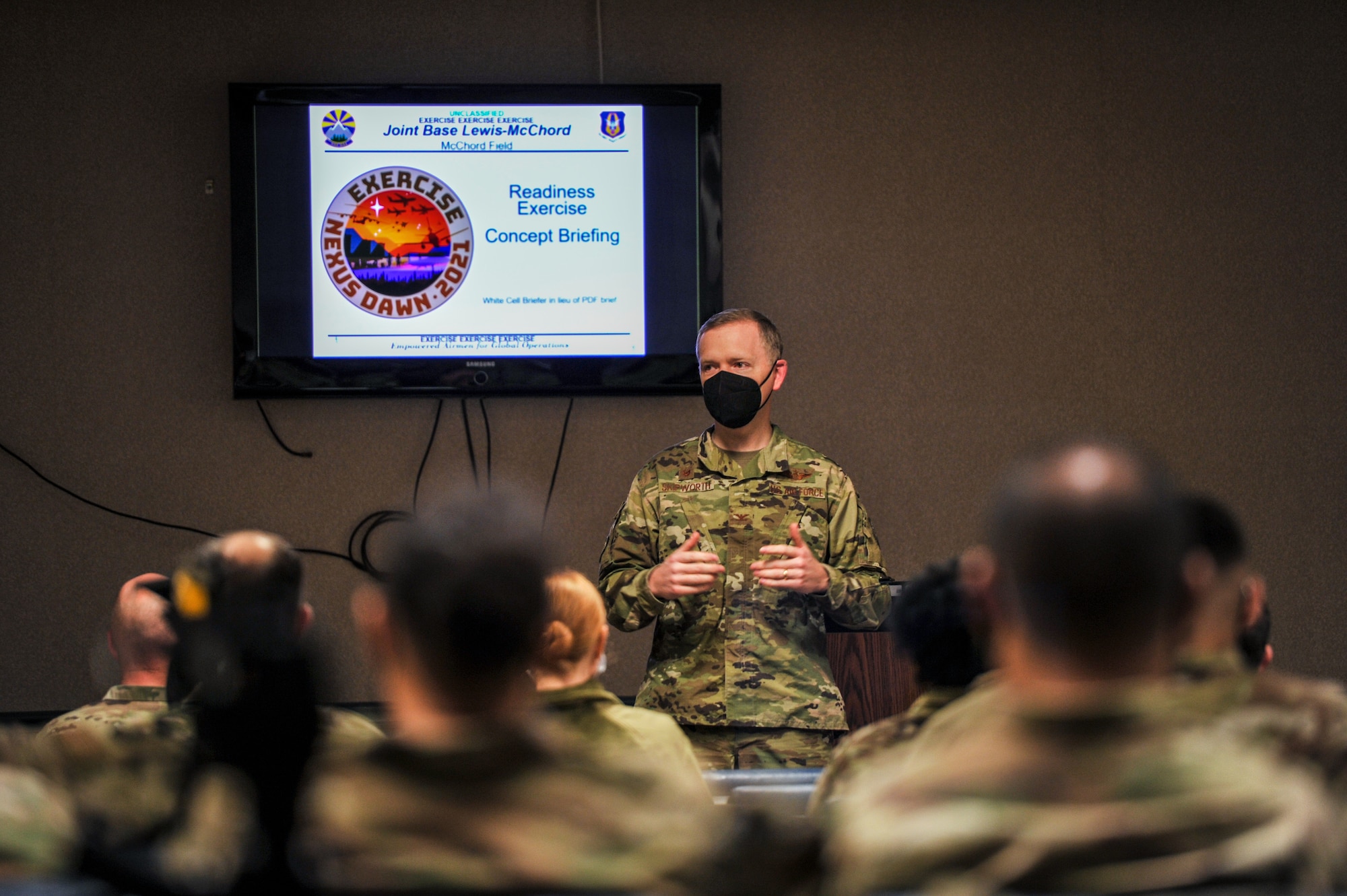 U.S. Air Force Col. Paul M. Skipworth, wing commander of the 446th Airlift Wing, provides opening remarks to wing Reserve Citizen Airmen participating in exercise NEXUS DAWN April 25, 2021 at Joint Base Lewis-McChord, Washington, before they depart for March Air Reserve Base, California.