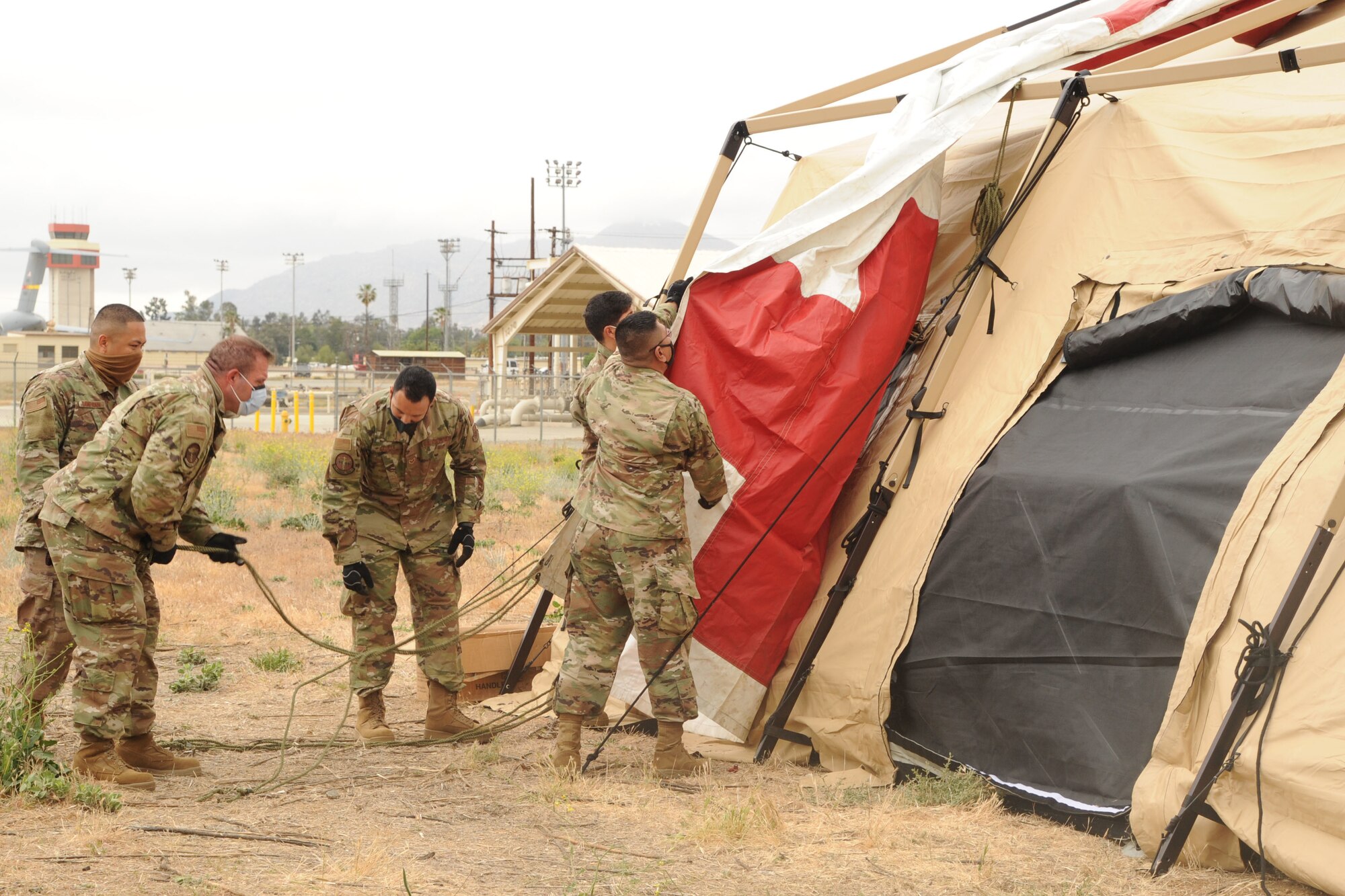 Reserve Citizen Airmen set up an expeditionary medical support system (EMEDS), a field hospital, in support of Exercise NEXUS DAWN at March Air Reserve Base, California, April 26, 2021.