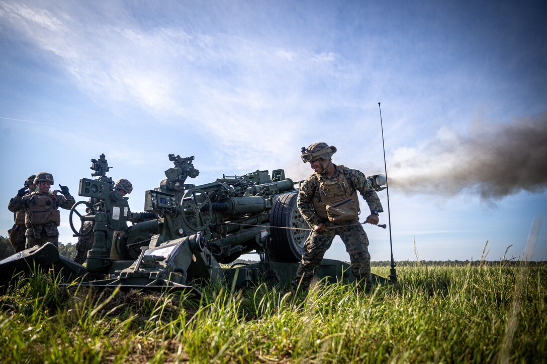 U.S. Marines with 2d Battalion, 10th Marine Regiment, 2d Marine Division, fire a M777 Howitzer in support of an artillery raid as part of Exercise Rolling Thunder 21.2 at Camp Lejeune, N.C., April 28, 2021. This exercise is a 10th Marine Regiment-led live-fire artillery event that tests 10th Marines' abilities to operate in a simulated littoral environment against a peer threat in a dynamic and multi-domain scenario. (U.S. Marine Corps photo by Lance Cpl. Brian Bolin Jr.)