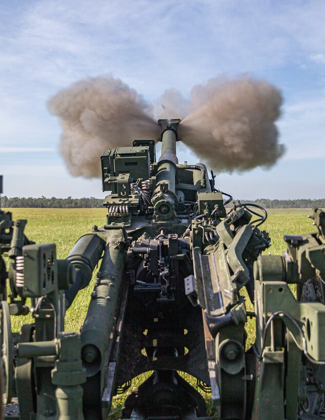 U.S. Marines with 2d Battalion, 10th Marine Regiment, 2d Marine Division, fire a M777 Howitzer during an artillery raid as part of Exercise Rolling Thunder 21.2 at Camp Lejeune, N.C., April 28, 2021. This exercise is a 10th Marine Regiment-led live-fire artillery event that tests 10th Marines' abilities to operate in a simulated littoral environment against a peer threat in a dynamic and multi-domain scenario. (U.S. Marine Corps photo by Lance Cpl. Brian Bolin Jr.)