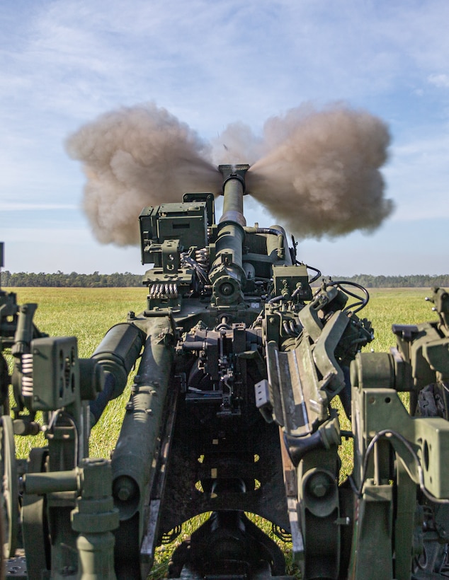 U.S. Marines with 2d Battalion, 10th Marine Regiment, 2d Marine Division, fire a M777 Howitzer during an artillery raid as part of Exercise Rolling Thunder 21.2 at Camp Lejeune, N.C., April 28, 2021. This exercise is a 10th Marine Regiment-led live-fire artillery event that tests 10th Marines' abilities to operate in a simulated littoral environment against a peer threat in a dynamic and multi-domain scenario. (U.S. Marine Corps photo by Lance Cpl. Brian Bolin Jr.)